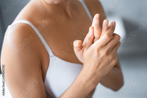 Young Caucasian woman using a hand cream