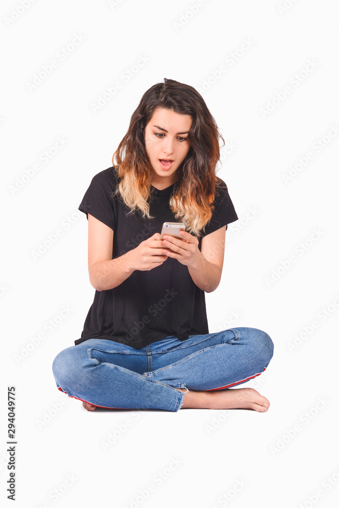 Young beautiful woman using her smartphone
