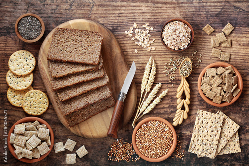 High fibre healthy food concept with wholegrain rye bread, seeded crackers, cereals, grains, buckwheat, barley & seeds. Health food high in antioxidants, omega 3, vitamins and protein with low gi. photo