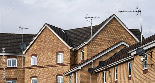 Generic new build housing estate rooftops.