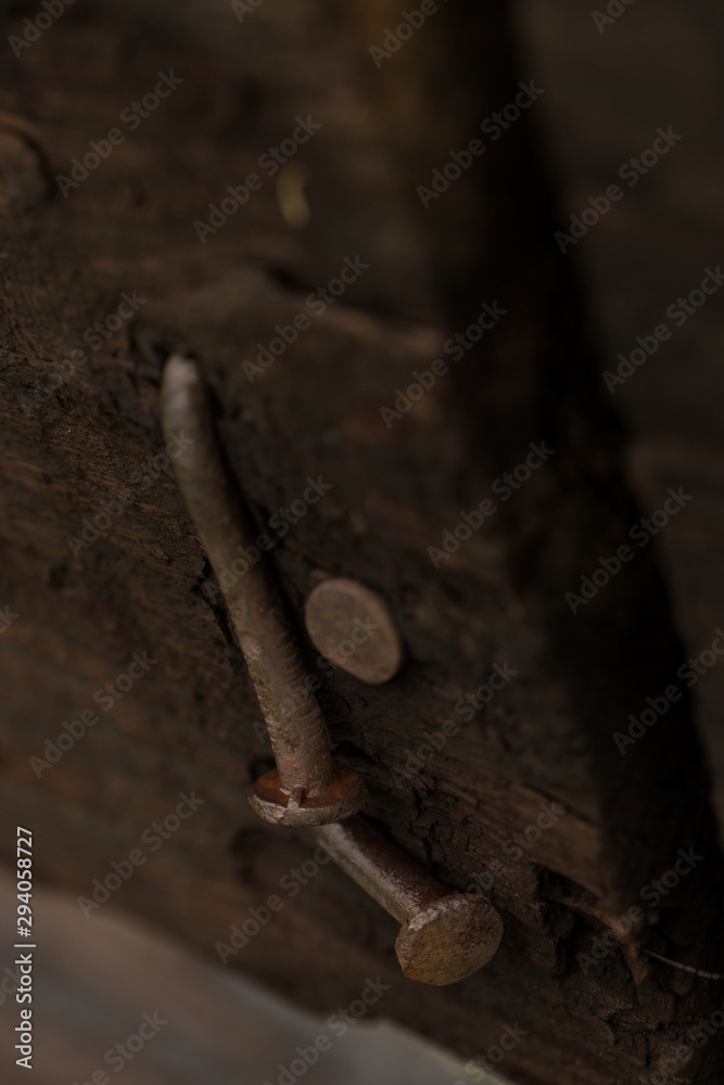 Close up of nails on a fence on a cattle ranch Close up of nails on a fence on a cattle ranch