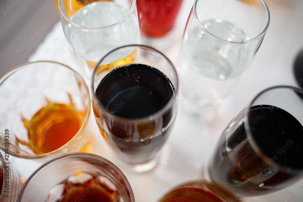Glass glasses with drinks stand on a table Glass glasses with drinks stand on a table