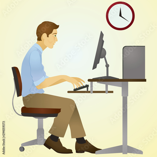 Young Man Typing on a Computer
