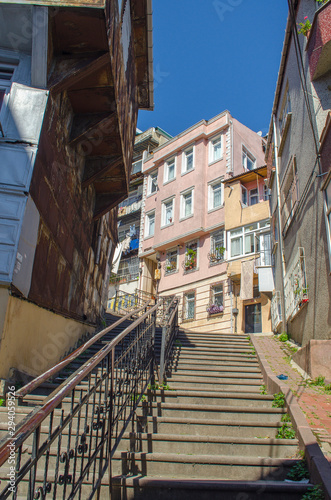 Narrow streets with low colorful houses. Mediterranean style. Middle Eastern flavor. Historical concept. Hipster background. Facades of buildings decorated in boho style. Turkey  Istanbul