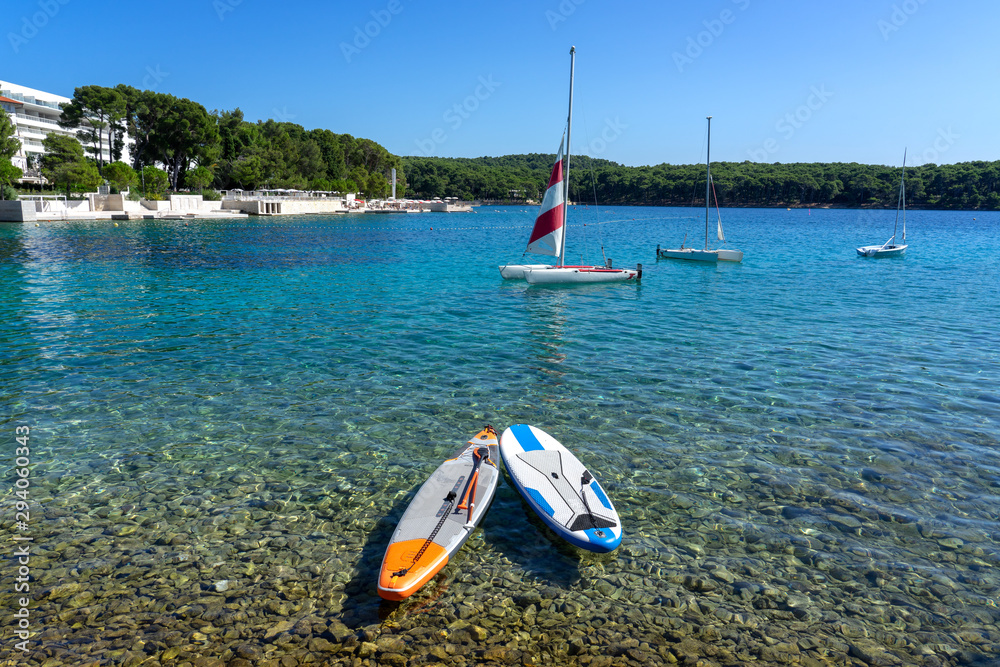 2 sub boards paddleboards on the crystal clear water sea in croatia 2 sub boards paddleboards on the crystal clear water sea in croatia