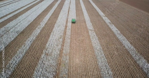 Aerial Image of a Six row Cotton picker working in a large field.