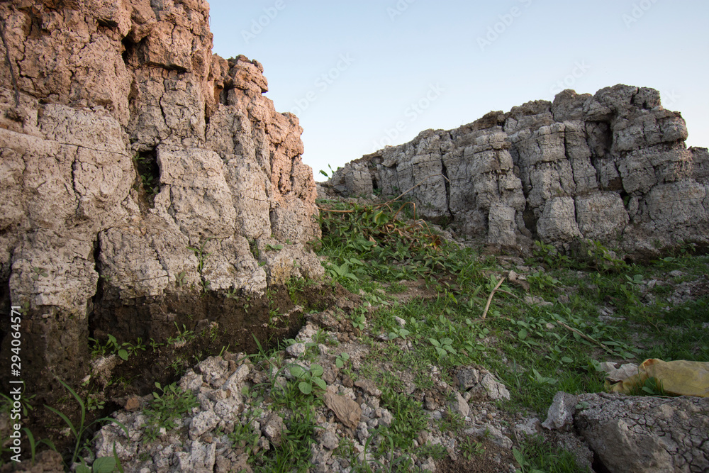Fototapeta premium The curb erosion from storms. To indicate the layers of soil and rock.