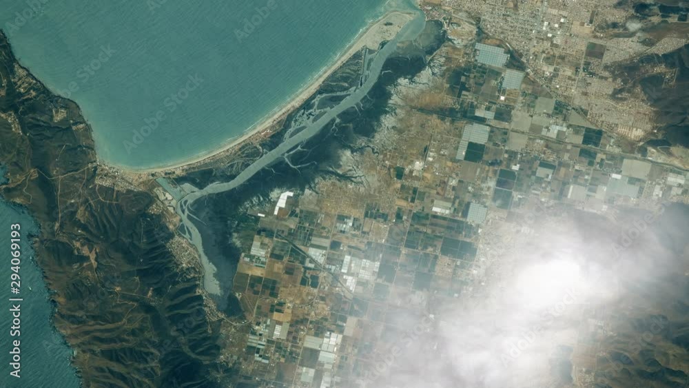 Aerial satellite view of Punta Banda, Baja California coastline with clouds animation. Contains public domain image by Nasa
