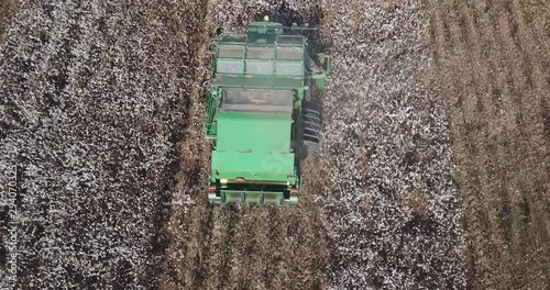 Cotton harvest - Aerial footage of a large combine harvester working on a large cotton field.