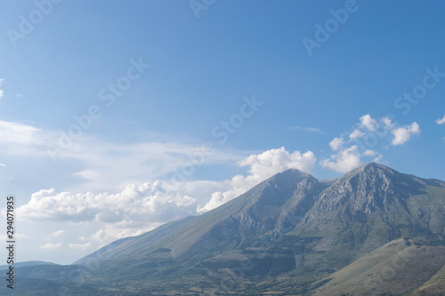 View of mountains and blue sky with clouds