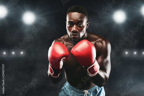 Focused boxer ready to attack his contestant © Prostock-studio