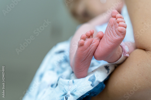 Newborn tiny feet. The first few hours in the world.