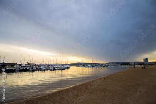 Dramatic Sunset Sky over the Beach of Palamós on the Spanish Costa Brava with Yachts in the Foreground © Nieuwenkampr