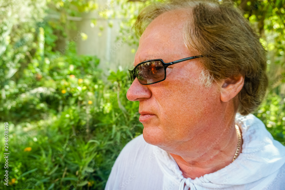 Pensive Mature man looks in front of him Pensive Mature man looks in front of him