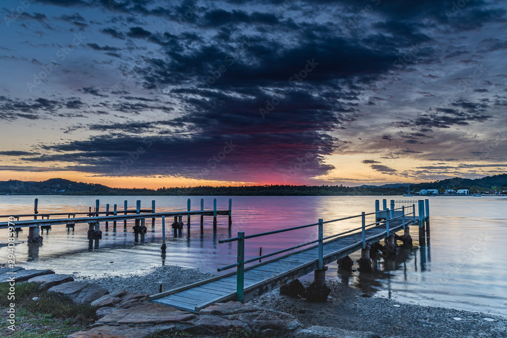 Fototapeta premium Early Morning Clouds and Reflections on the Bay