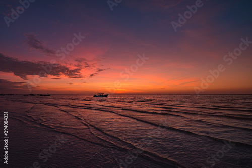 Amazing sunset at Holbox Island in the Caribbean Ocean of Mexico photo