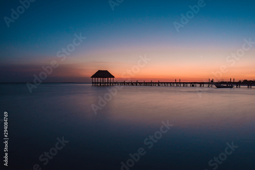 Amazing sunset at Holbox Island in the Caribbean Ocean of Mexico photo