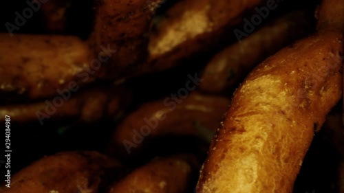 A pile of small bretzels or pretzels, a type of German baked bread, macro dolly probe clip, shot on Red photo