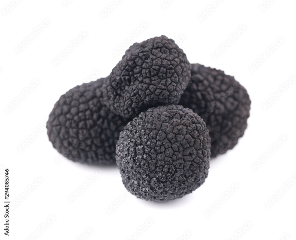 Black truffles isolated on a white background. Delicacy exclusive truffle mushroom. Piquant and fragrant French delicacy. Clipping path. Black truffles isolated on a white background. Delicacy exclusive truffle mushroom. Piquant and fragrant French delicacy. Clipping path.