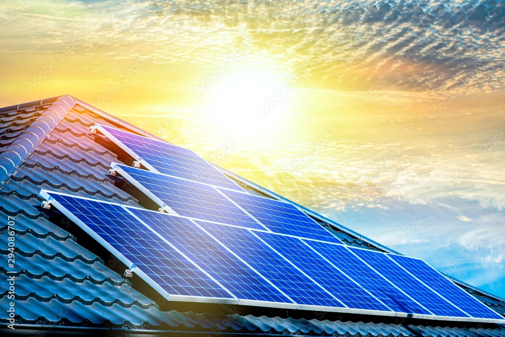 Solar panels on the roof of a building . Solar cells for solar energy . apartment house