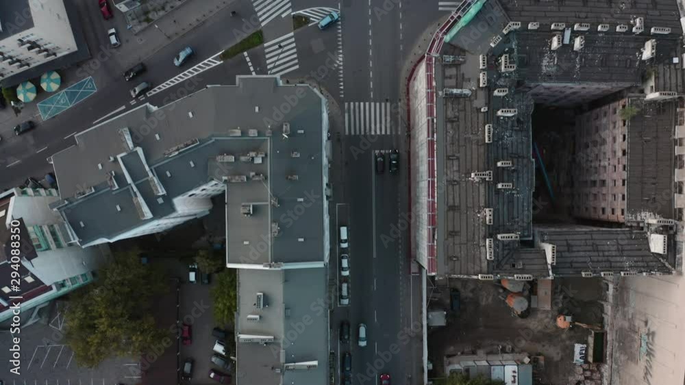 Aerial view. Car traffic on the road and people cross the street during the day in the center of Warsaw drone aerial view from above. Drone shot on the street with intersections and cars. 4K Shot. Aerial view. Car traffic on the road and people cross the street during the day in the center of Warsaw drone aerial view from above. Drone shot on the street with intersections and cars. 4K Shot.