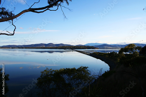 Schilderij op canvas Refections in the dusk at Midway Point. Tasmania.