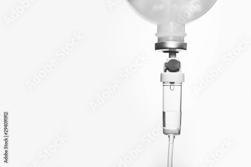 0.9% Normal saline solution (NSS) isolated on white background and for medical background. Close up image. Drops of saline. 