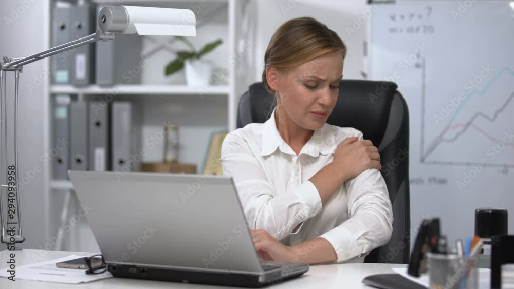 Lady in office feeling shoulder pain, muscle sprain, problems with health Lady in office feeling shoulder pain, muscle sprain, problems with health