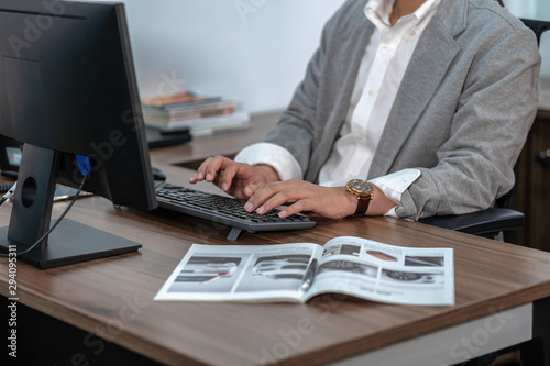 Closeup Asian Businessman in formal suit hand typing computer keyboard in office  business and technology workplace concept