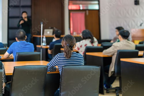 Rear view of Audience listening Speakers on the stage in the conference hall or seminar meeting  business and education about investment concept
