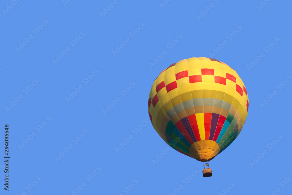 Colorful hot air balloon isolate on blue sky background Colorful hot air balloon isolate on blue sky background