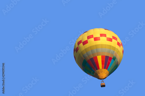 Colorful hot air balloon isolate on blue sky background