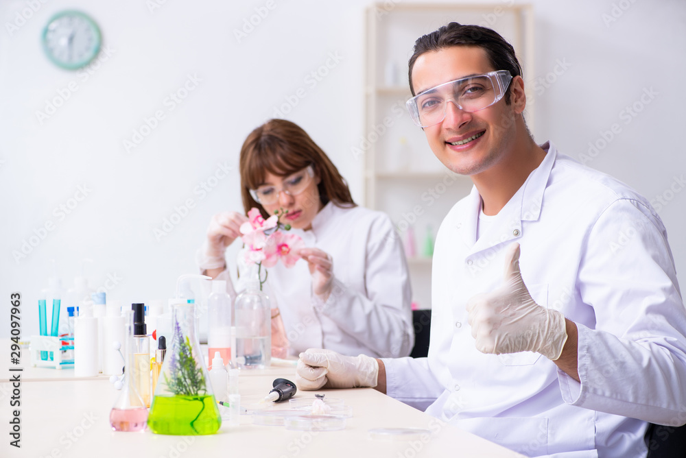 Two chemists working in the lab Two chemists working in the lab