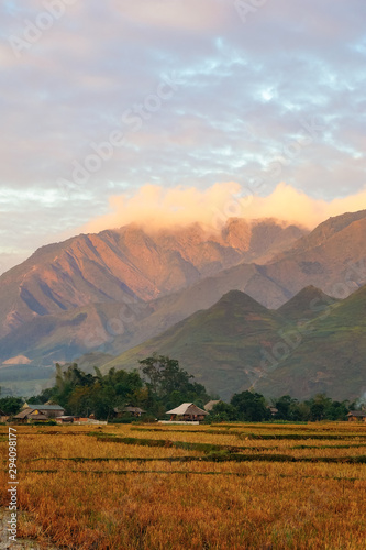 The beautiful landscape of Sapa with mountains  clouds  blue sky  and rice fields at sunset in the countryside Vietnam. Royalty high-quality stock image of a landscape.