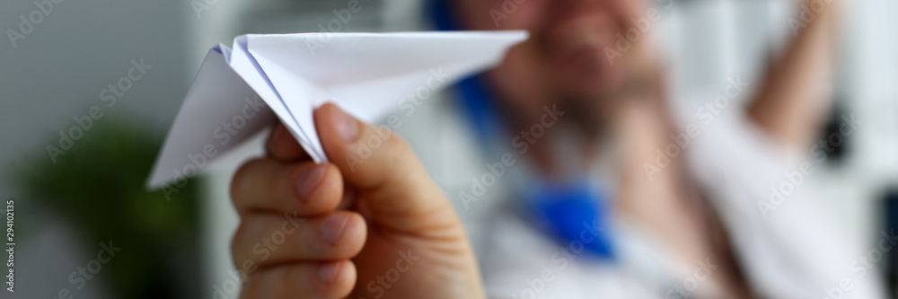 Man wearing suit and tie in goggles and snorkel play with fly paper plane in office closeup. Count days to leave annual day off workaholic freedom fun tourism resort idea ticket sale overseas concept Man wearing suit and tie in goggles and snorkel play with fly paper plane in office closeup. Count days to leave annual day off workaholic freedom fun tourism resort idea ticket sale overseas concept