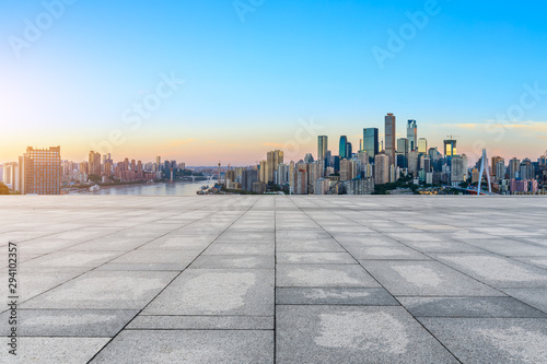 Empty square floor and modern city skyline in chongqing at sunrise,China. © ABCDstock