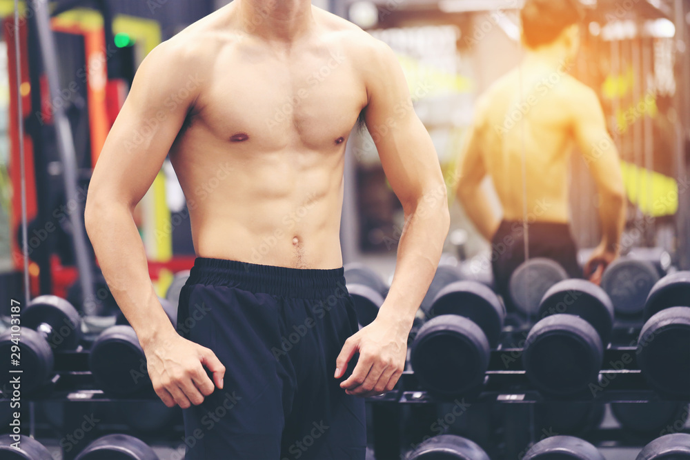 Foto Stock Handsome men with perfect fitness body the sport gym, Healthy  lifestyle and sport concept | Adobe Stock