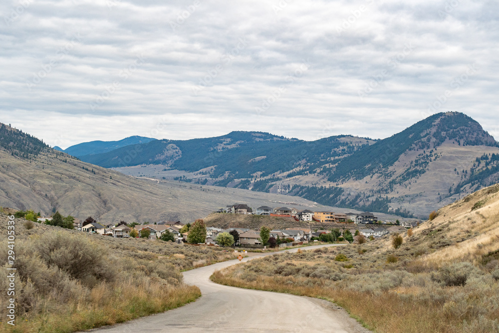 2019-10-05 Kamloops, BC, Canada. Entering Kamloops from Lac Du Bois protected area, Batchelor heights neighborhood, forested mount Paul. 2019-10-05 Kamloops, BC, Canada. Entering Kamloops from Lac Du Bois protected area, Batchelor heights neighborhood, forested mount Paul.