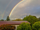 Rainbow view from the window in Browns Bay, Auckland, New Zealand