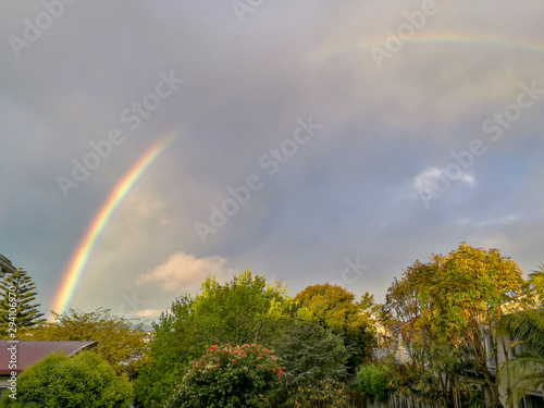Fototapeta Naklejka Na Ścianę i Meble -  Rainbow view from the window in Browns Bay, Auckland, New Zealand