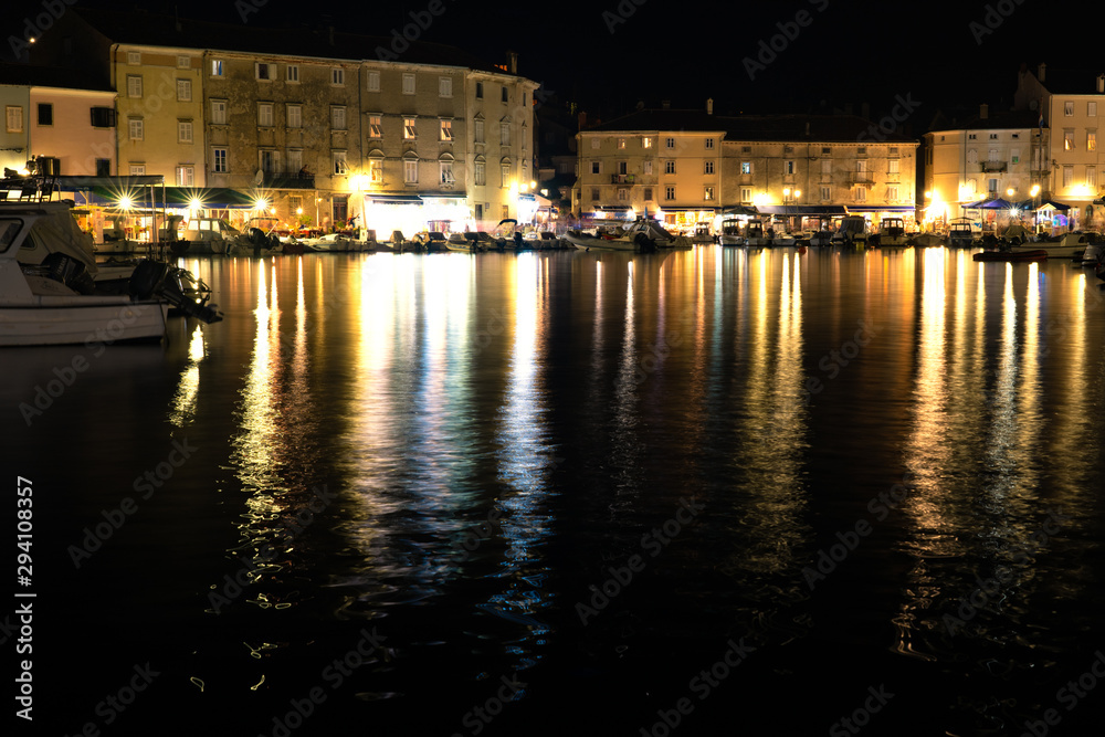 cres city bay on cres island at night water reflection long exposure