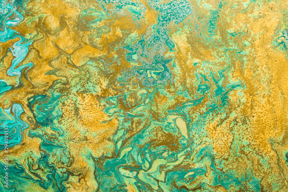 Abstract golden spots on mint green background with golden inclusions. Free flowing paint. Acrylic fluid art