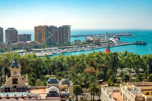 Aerial panoramic view of Malaga city, Andalusia, Spain in a beautiful summer day with the town hall the port and the sea © Bernadett