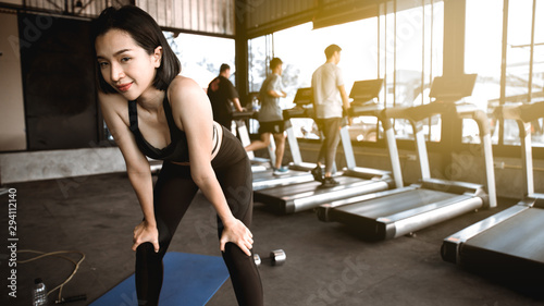 Asian woman exercise in gym. Sport woman relaxing. exercise in gym concept.