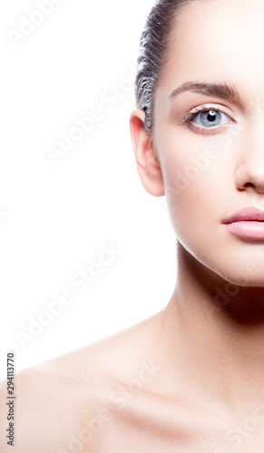 Beauty partial face of fashion model woman, healthy perfect skin, natural make-up. Copy space. Isolated. Whitebackground