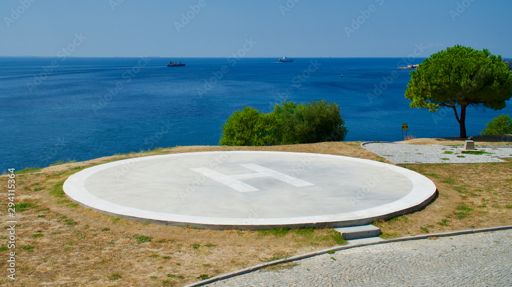 Obraz premium concrete helipad at coast of aegean sea