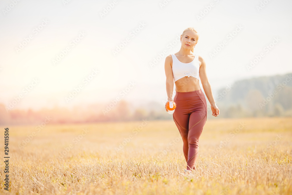 Young blond fitness woman runner athlete running park Sunrise Young blond fitness woman runner athlete running park Sunrise