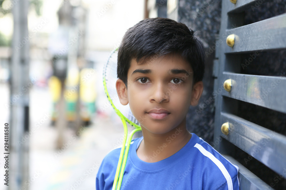 Indian Young teen boy playing badminton Stock Photo | Adobe Stock