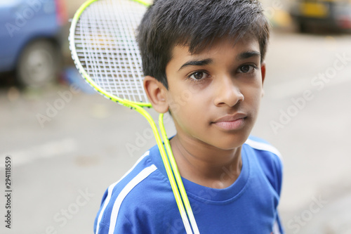 Indian Young teen boy playing badminton © V.R.Murralinath