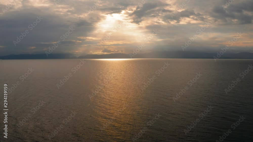 Clouds and rays of sun above the sea. Bright light with sun rays and heavy clouds above the sea. Seascape with dramatic sky. Clouds and rays of sun above the sea. Bright light with sun rays and heavy clouds above the sea. Seascape with dramatic sky.